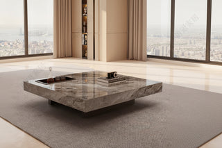 Modern living room with gray sofa, marble coffee table, and cityscape view.