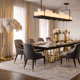 Elegant dining room with a large table, chairs, and decorative elements.