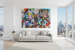 Large, colorful pop art canvas featuring iconic celebrities in a graffiti style, displayed above a light gray sofa in a modern living room with city views.