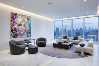 Marilyn Monroe American Sweetheart pop art canvas with pink bubblegum, framed, in a modern living room.