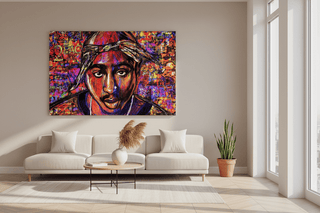 Vibrant TuPac graffiti canvas art with bold colors, displayed above a modern beige sofa in a bright room.
